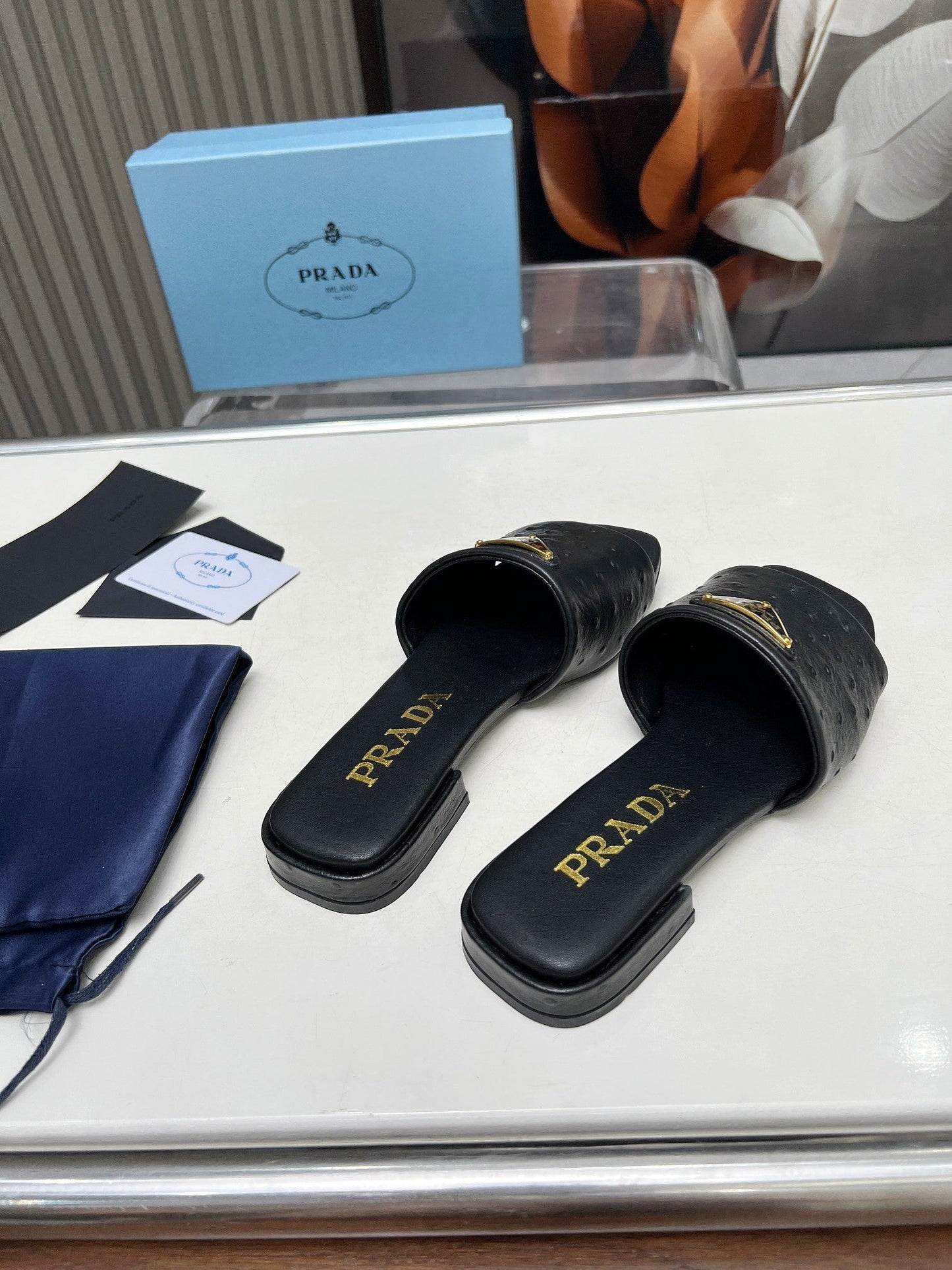 PRA SAFFIANO PATENT SLIDES OSTRICH MOTIF BLACK CALFSKIN - 35
