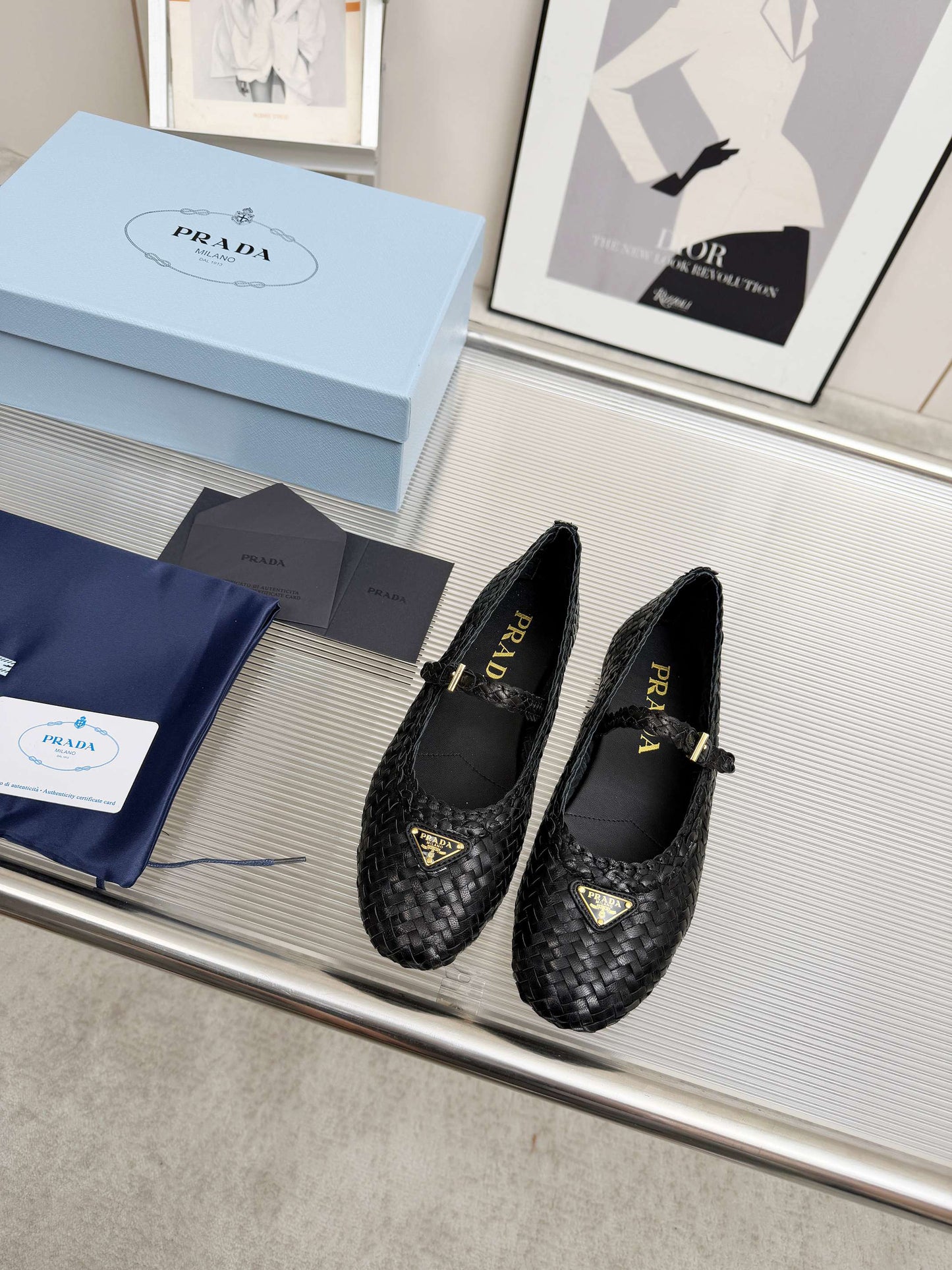 PRADA 26S MARY JANE FLATS IN BLACK WOVEN CALFSKIN