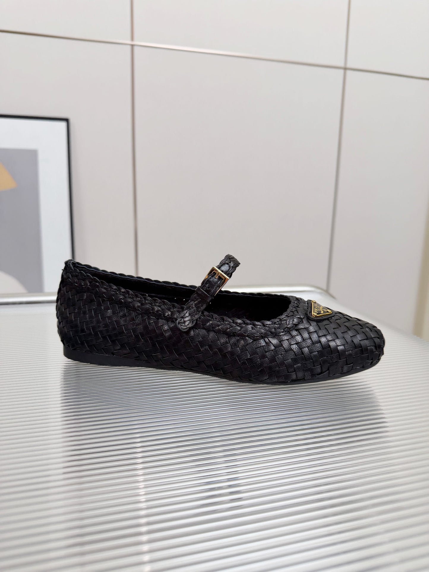 PRADA 26S MARY JANE FLATS IN BLACK WOVEN CALFSKIN