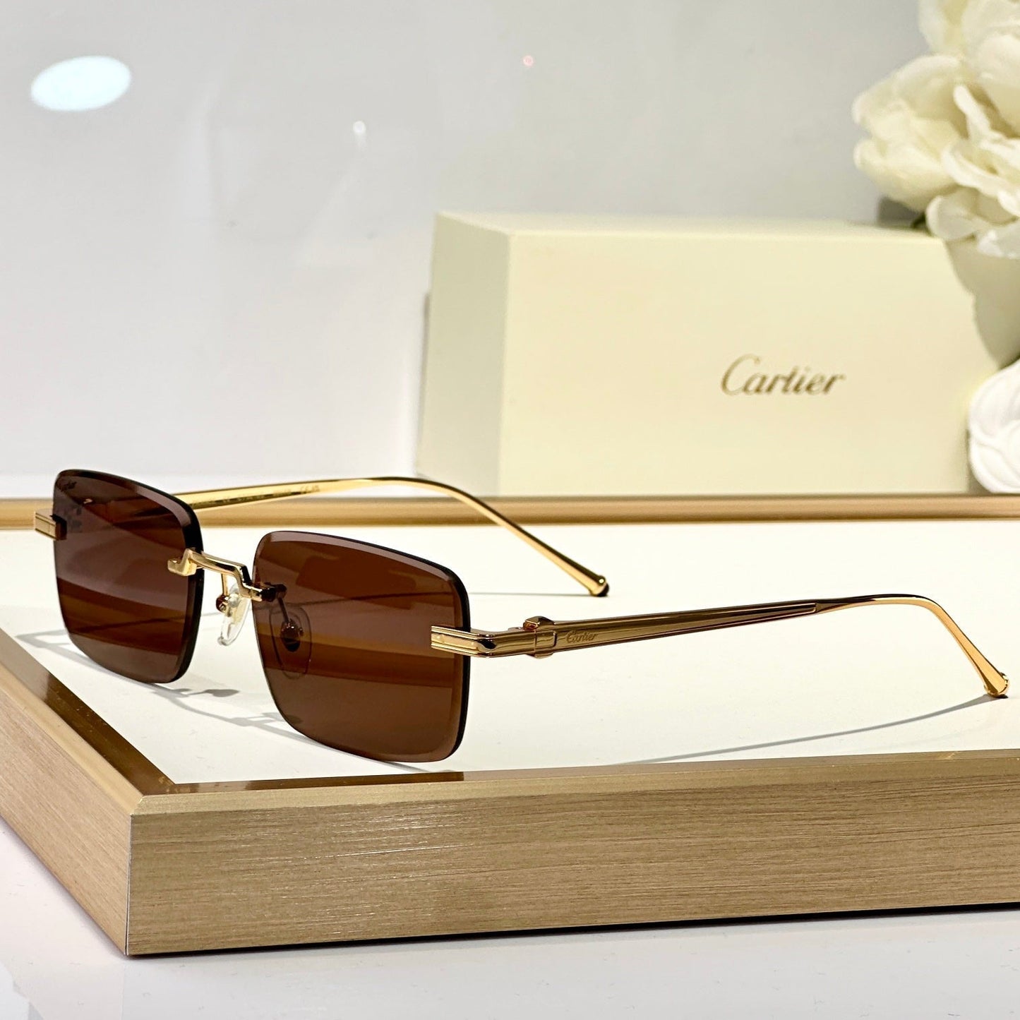 C DE RIMLESS SQUARE FRAME SUNGLASSES CT0610S IN METAL - Brown photochromic lenses