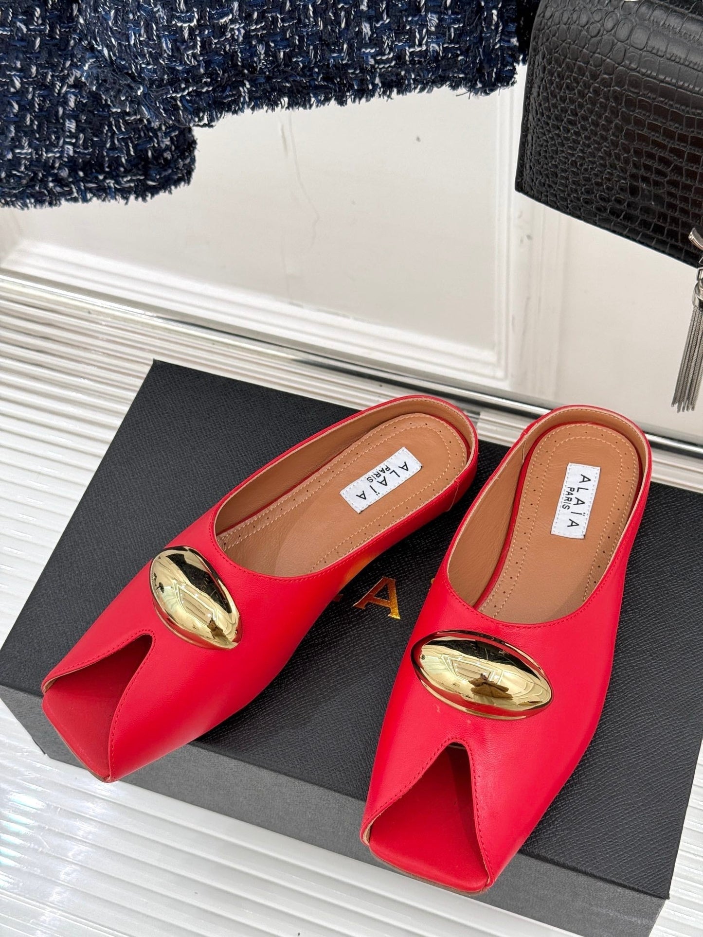 ALAIA FLAT MULE IN CRIMSON RED LAMBSKIN WITH GOLD HARDWARE - 35