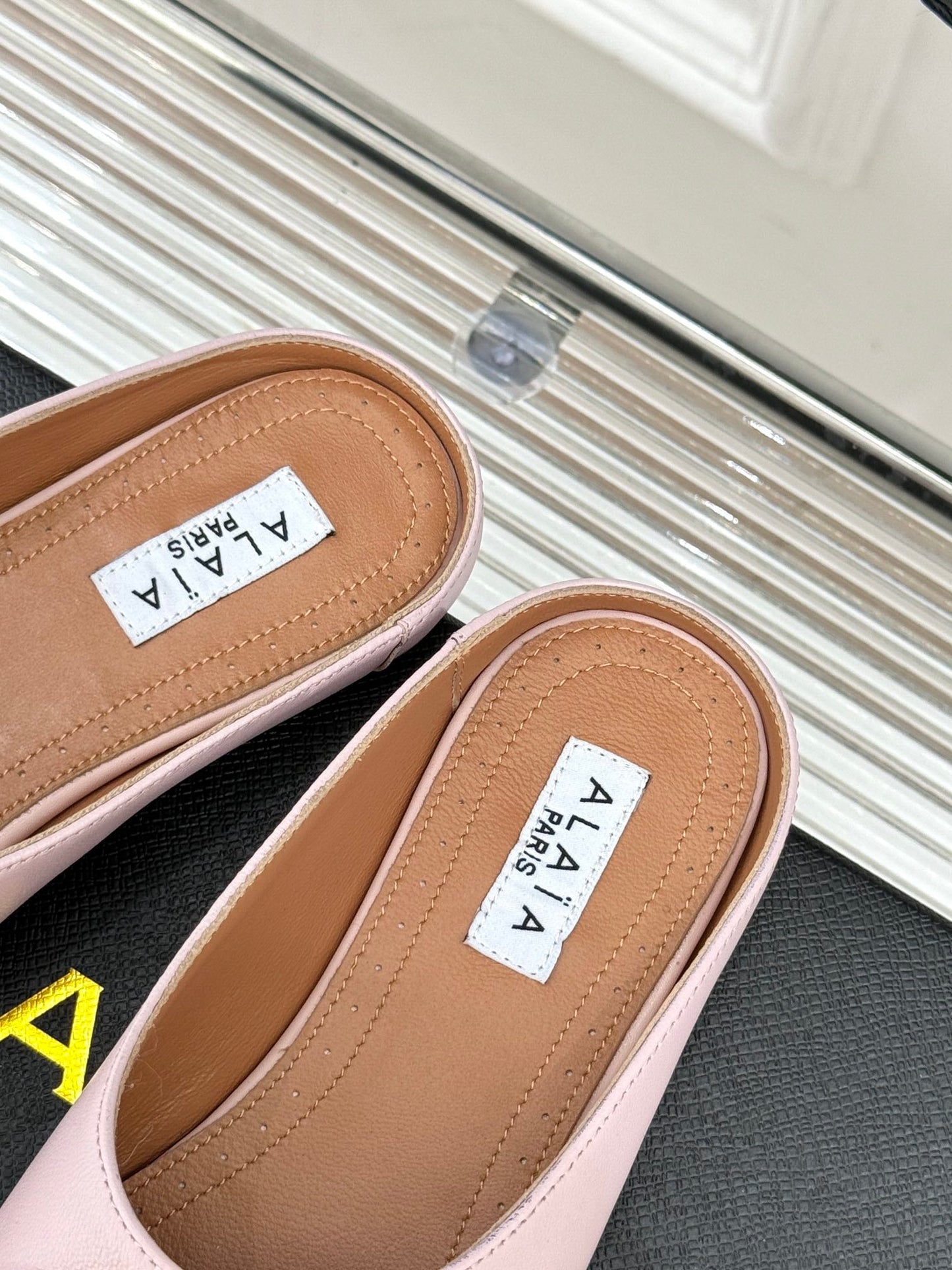 ALAIA FLAT MULE IN LIGHT PINK LAMBSKIN WITH GOLD HARDWARE - 35