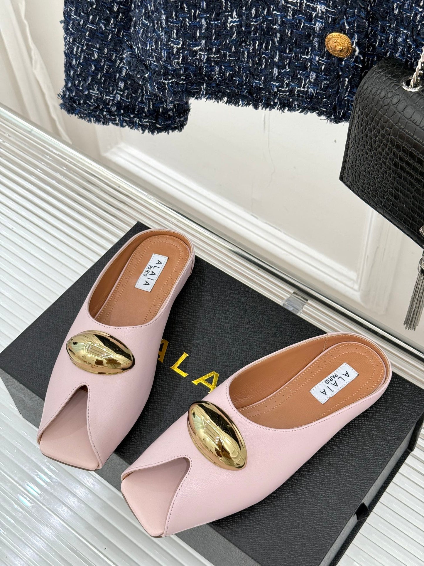 ALAIA FLAT MULE IN LIGHT PINK LAMBSKIN WITH GOLD HARDWARE - 35