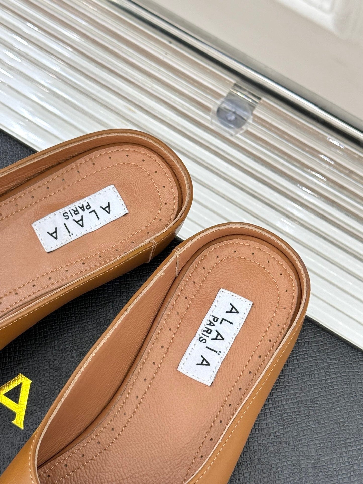 ALAIA FLAT MULE IN BRONZE BROWN LAMBSKIN WITH GOLD HARDWARE - 35