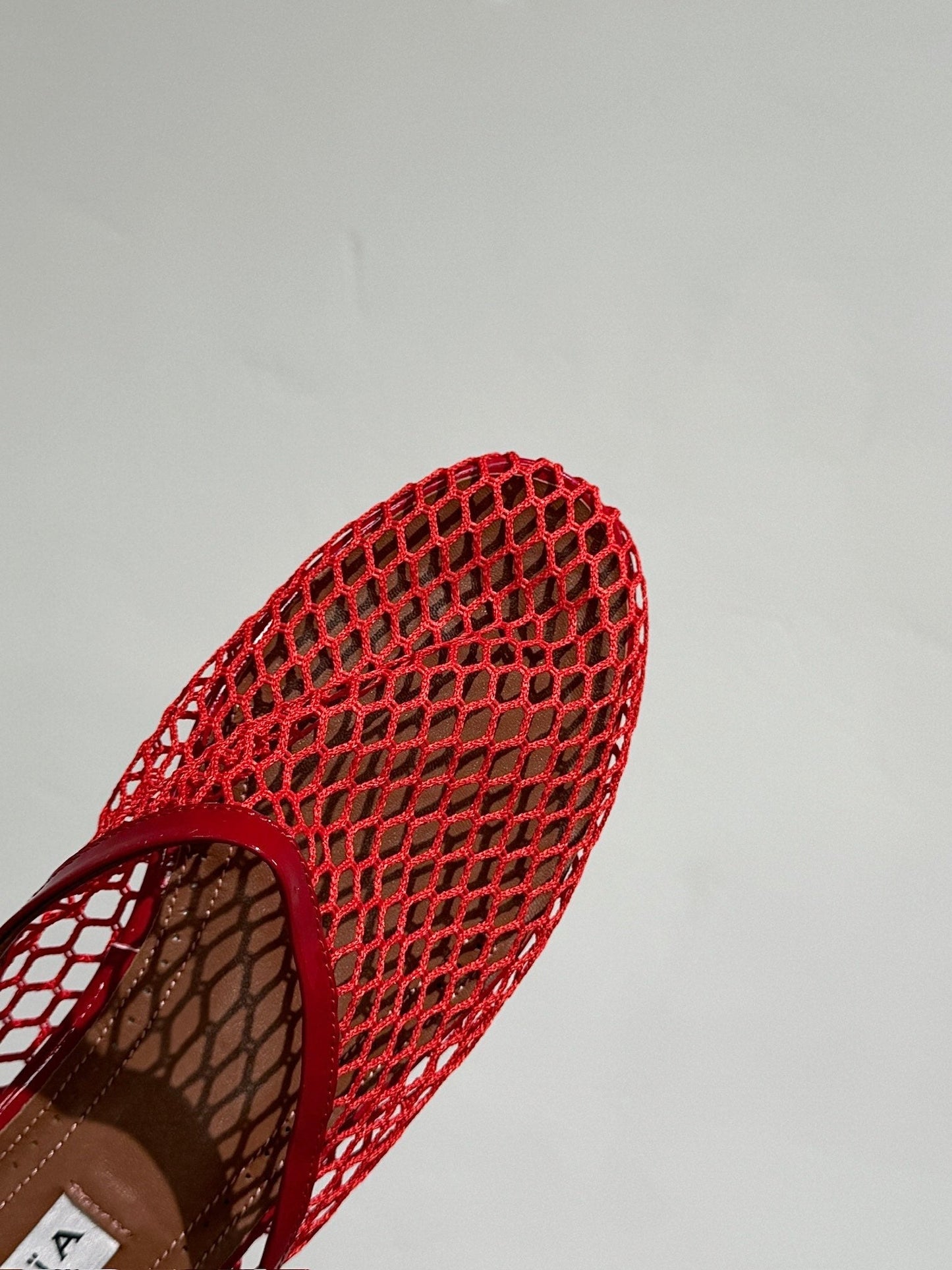 ALAIA FLAT MULES IN CHERRY RED MESH FISHNET - 34