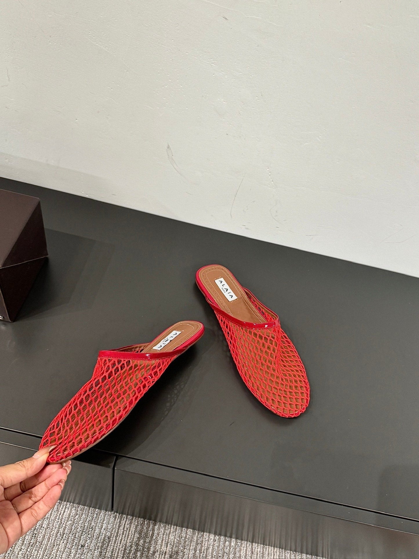 ALAIA FLAT MULES IN CHERRY RED MESH FISHNET - 34