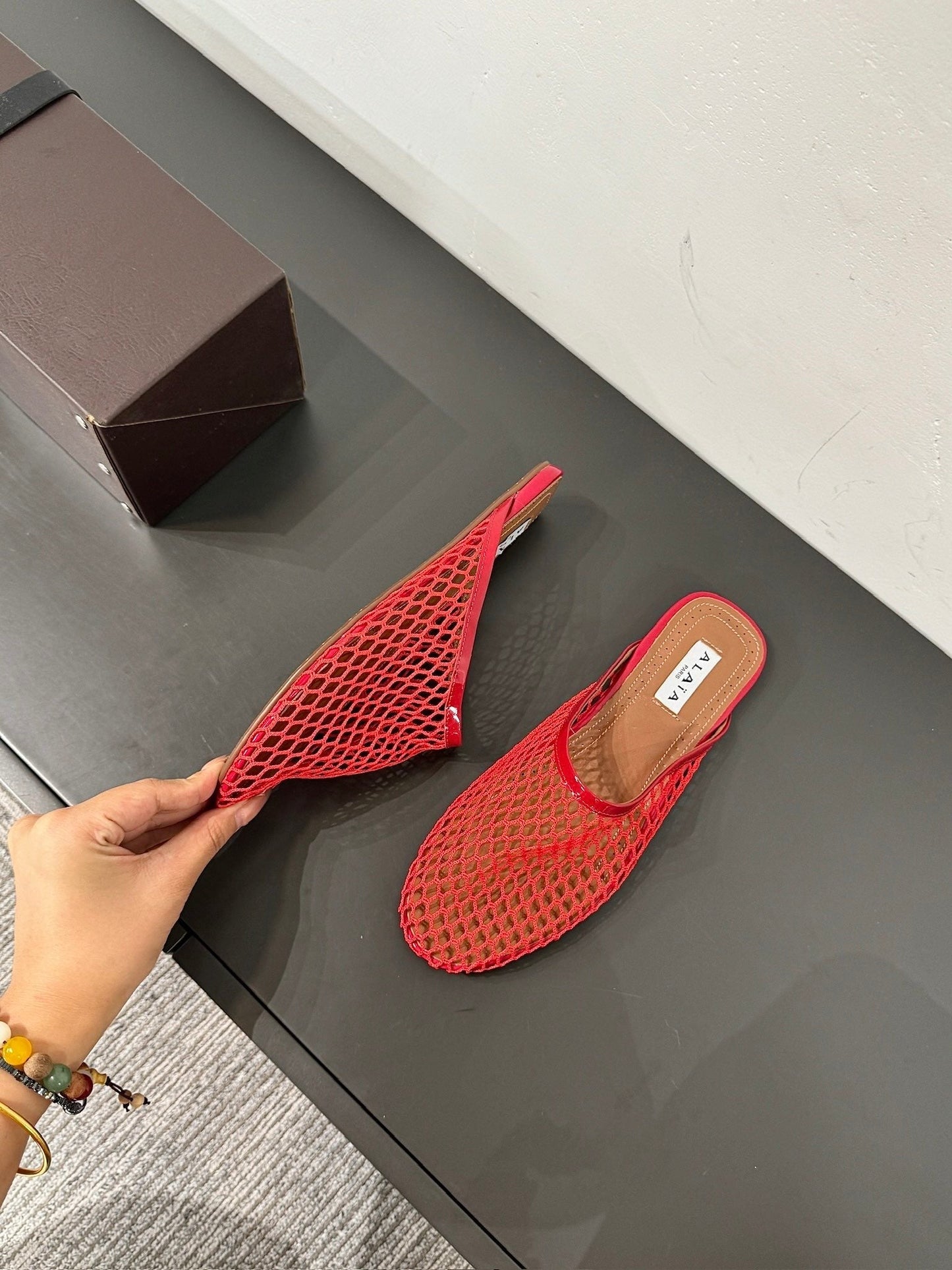 ALAIA FLAT MULES IN CHERRY RED MESH FISHNET - 34