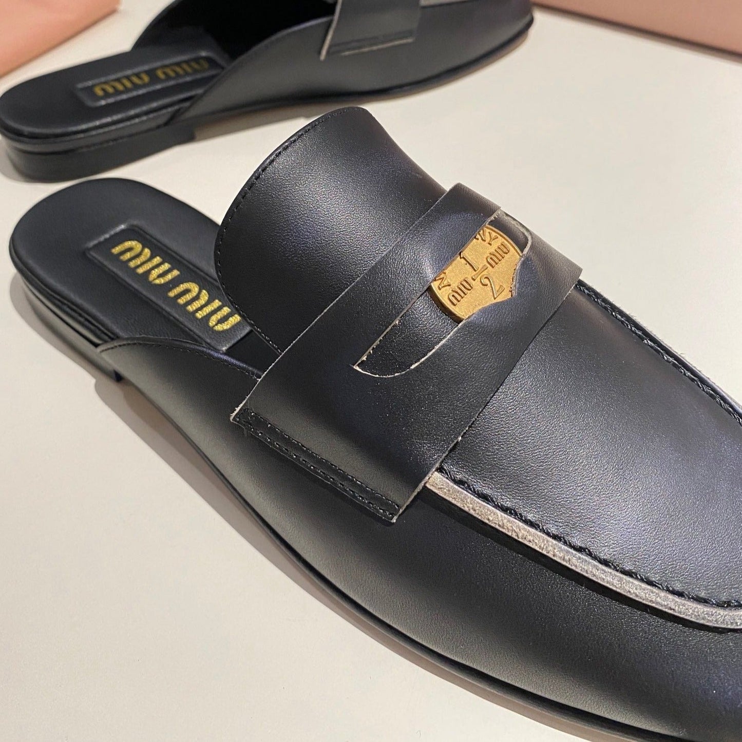 MULES SLIPPERS BLACK COWHIDE WITH GOLD COIN - 34