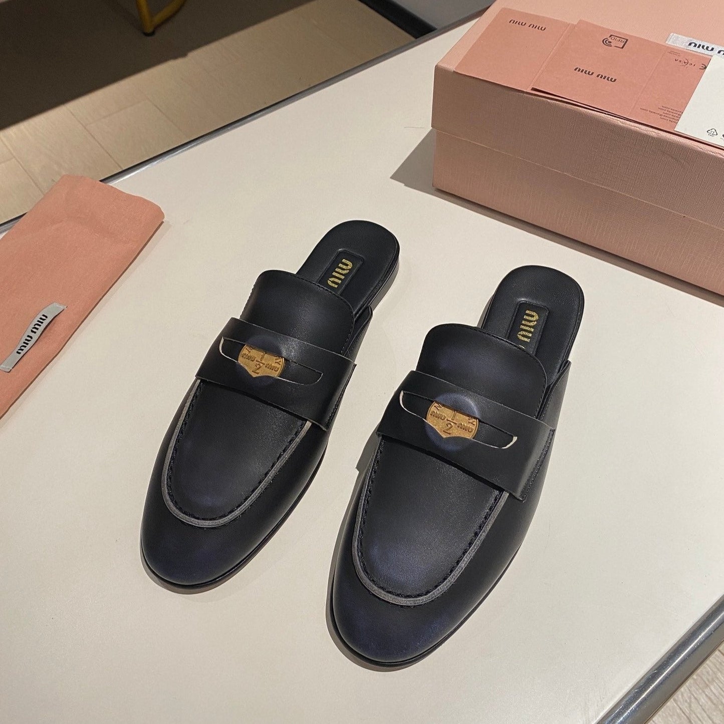 MULES SLIPPERS BLACK COWHIDE WITH GOLD COIN - 34