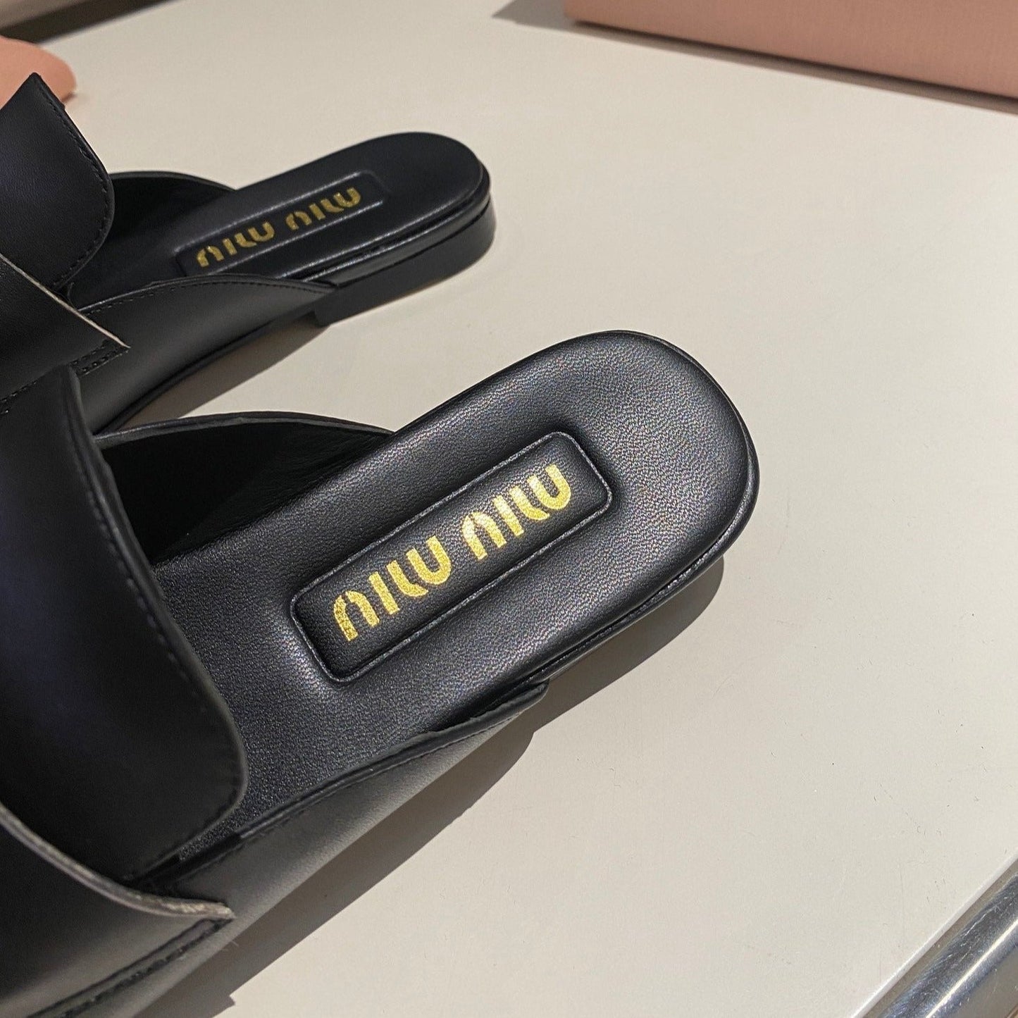 MULES SLIPPERS BLACK COWHIDE WITH GOLD COIN - 34