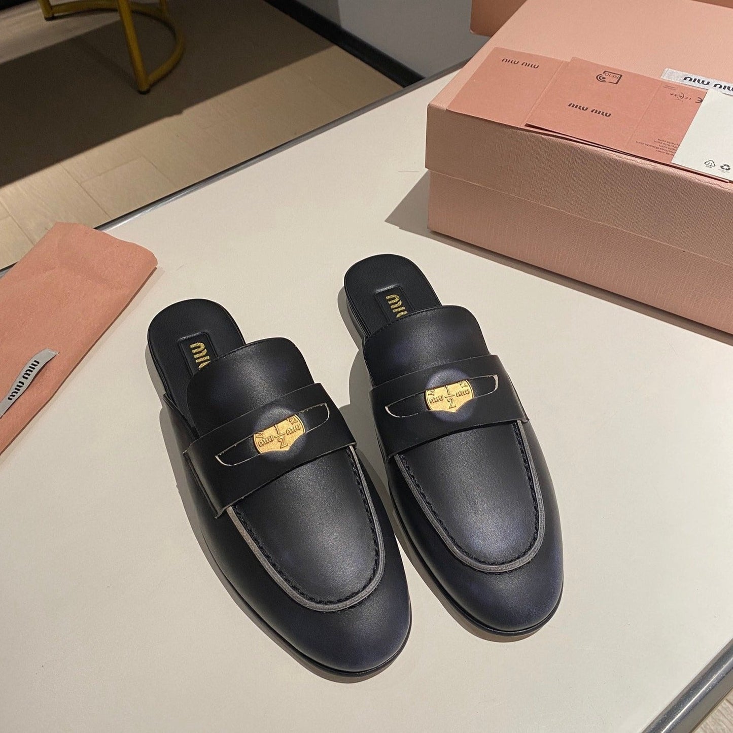 MULES SLIPPERS BLACK COWHIDE WITH GOLD COIN - 34
