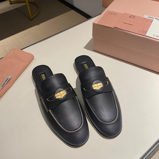 MULES SLIPPERS BLACK COWHIDE WITH GOLD COIN - 34