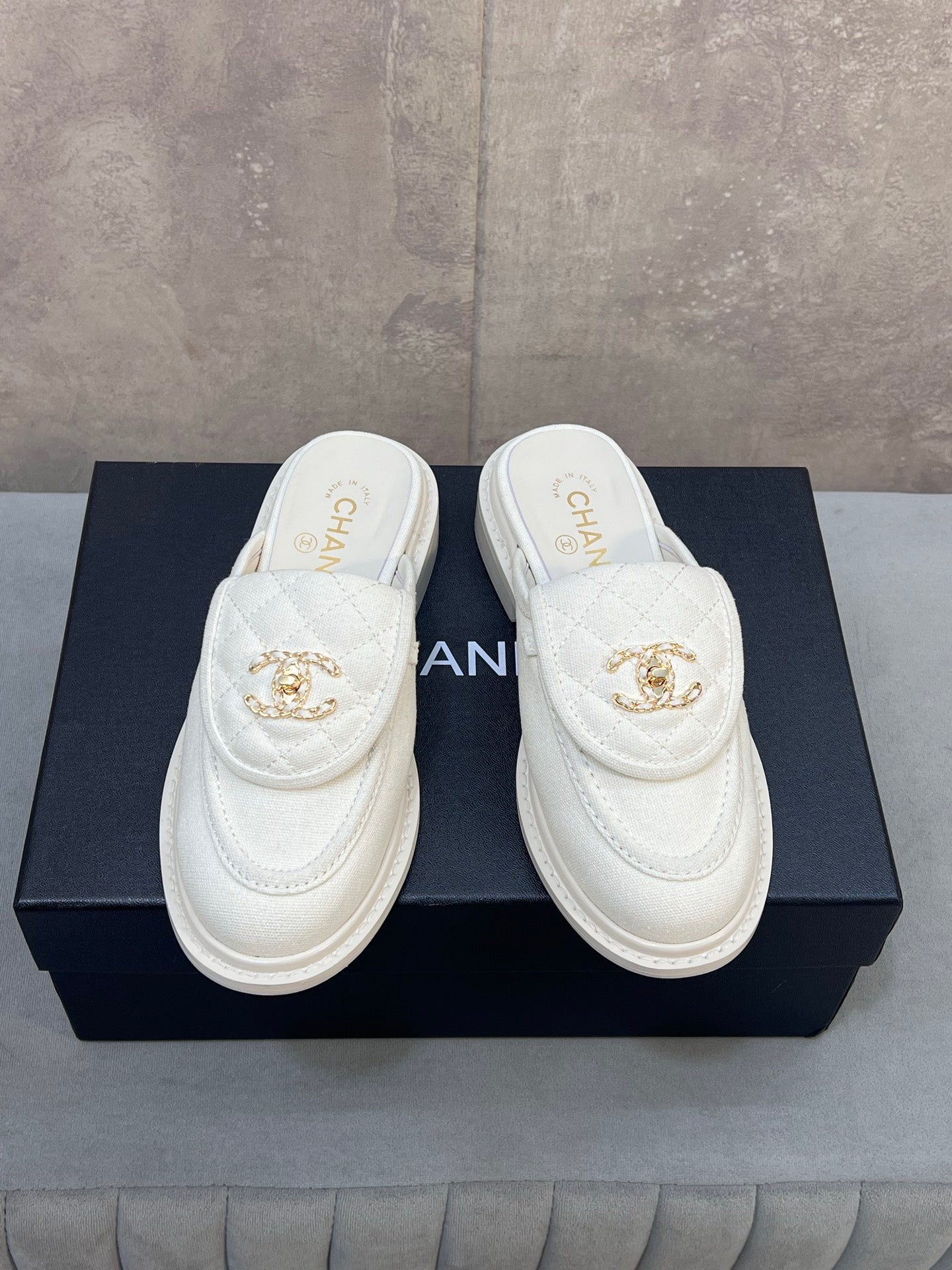 CHANEL 26S MULE LOAFERS IN WHITE CANVAS WITH QUILTED FLAP & CC LOGO