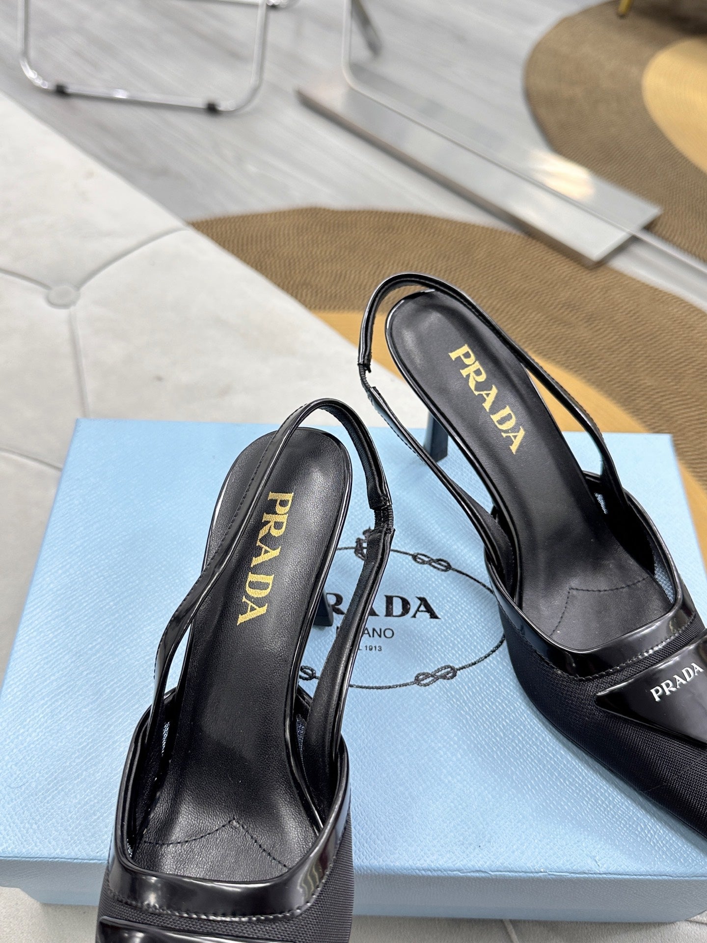 PRADA 25S TRIANGLE LOGO SLINGBACK PUMPS IN BLACK MESH FABRIC - 35