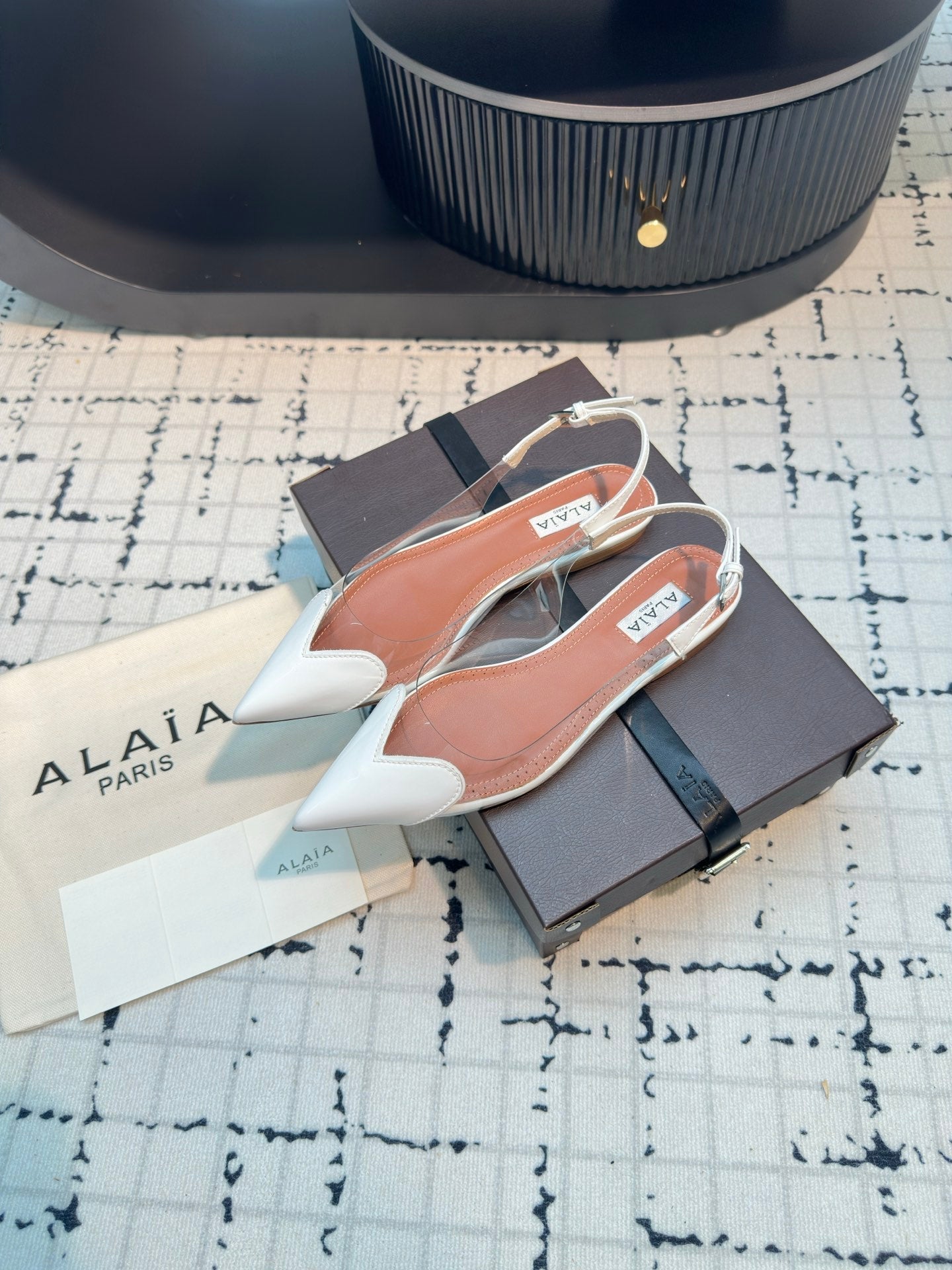 ALAIA FLAT SLINGBACK IN WHITE PATENT CALFSKIN AND FILM - 34