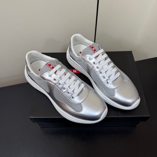 КРОСІВКИ PRADA 26S ЗІ СРІБНОЇ ТЕЛЯЧОЇ ШКІРИ ТА БІЛОЇ СІТКИ