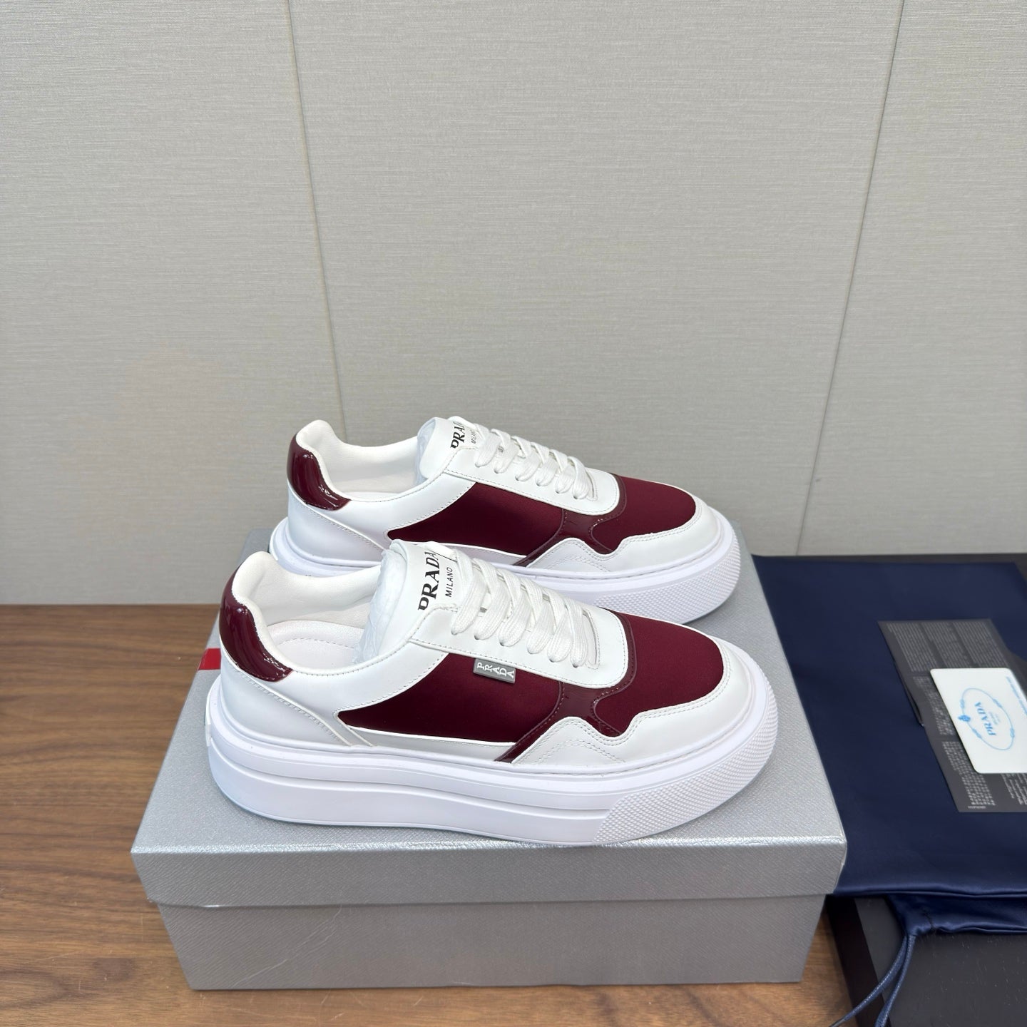 PRADA 25S DOWNTOWN BOLD SNEAKERS 45MM IN WHITE AND BURGUNDY CALFSKIN - 35