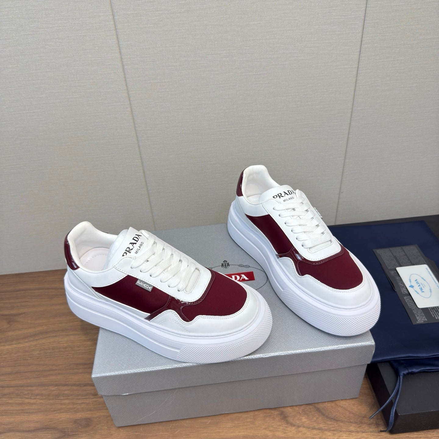 PRADA 25S DOWNTOWN BOLD SNEAKERS 45MM IN WHITE AND BURGUNDY CALFSKIN - 35