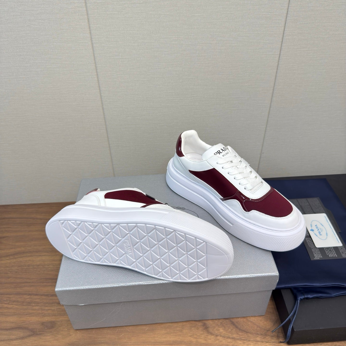 PRADA 25S DOWNTOWN BOLD SNEAKERS 45MM IN WHITE AND BURGUNDY CALFSKIN - 35