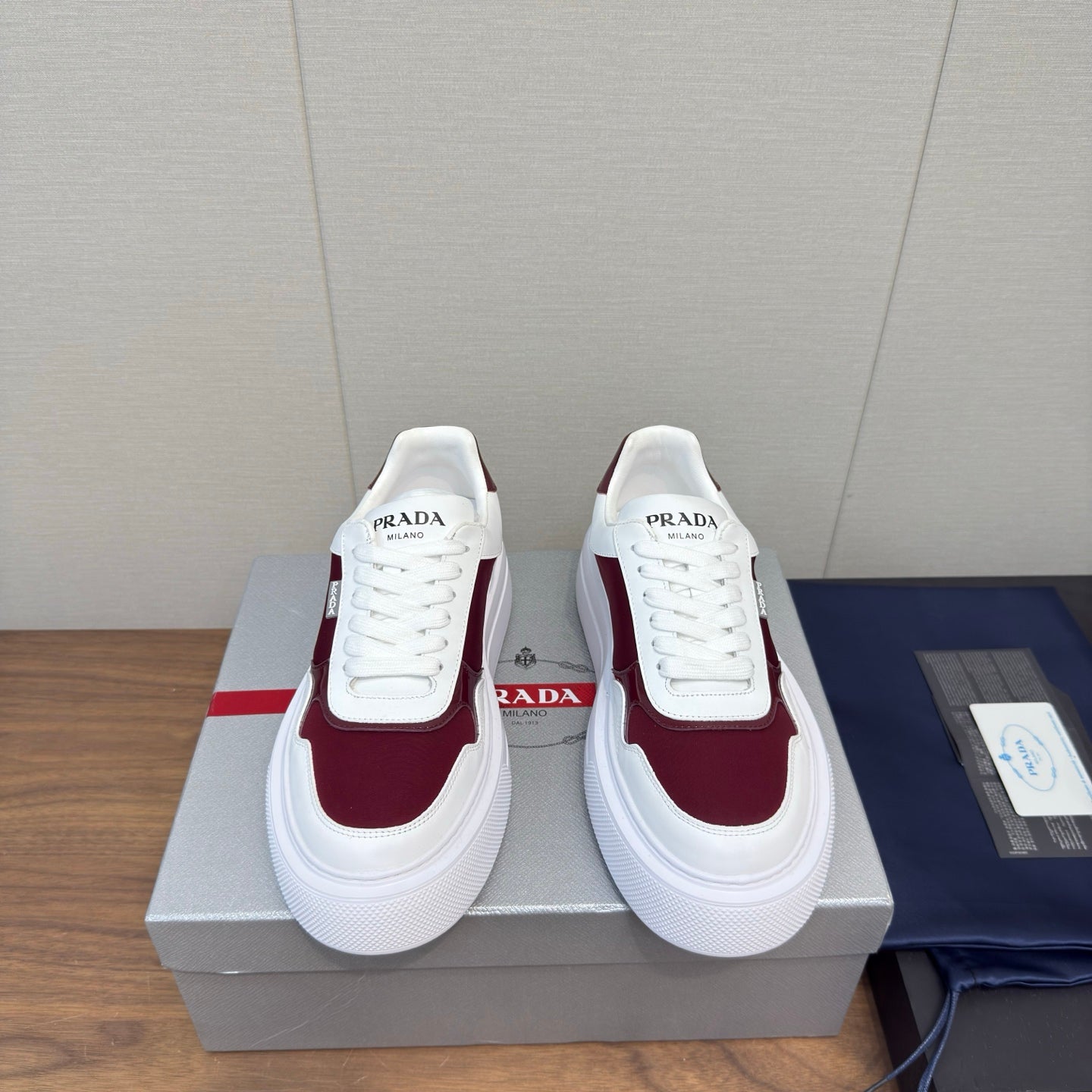 PRADA 25S DOWNTOWN BOLD SNEAKERS 45MM IN WHITE AND BURGUNDY CALFSKIN - 35