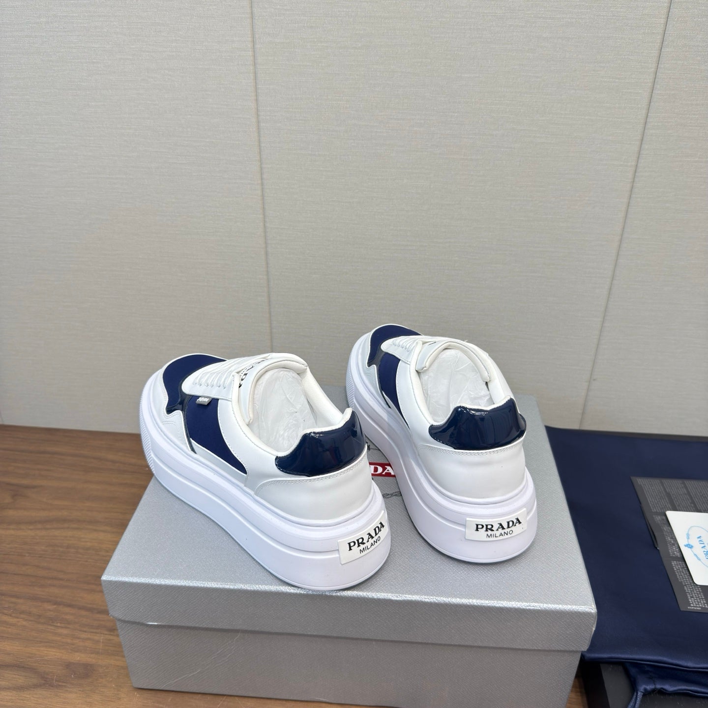 PRADA 25S DOWNTOWN BOLD SNEAKERS 45MM IN WHITE AND NAVY BLUE CALFSKIN - 35