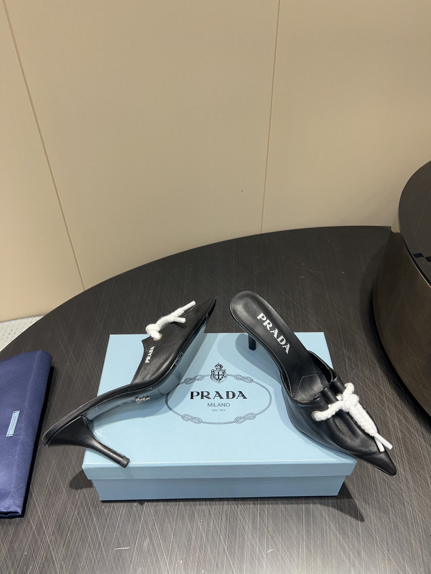 PRADA 25S BRAIDED DETAIL MULES 85MM IN BLACK CALFSKIN - 35