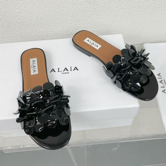 ALAIA FLAT MULE IN BLACK GLOSSY LAMBSKIN - 34