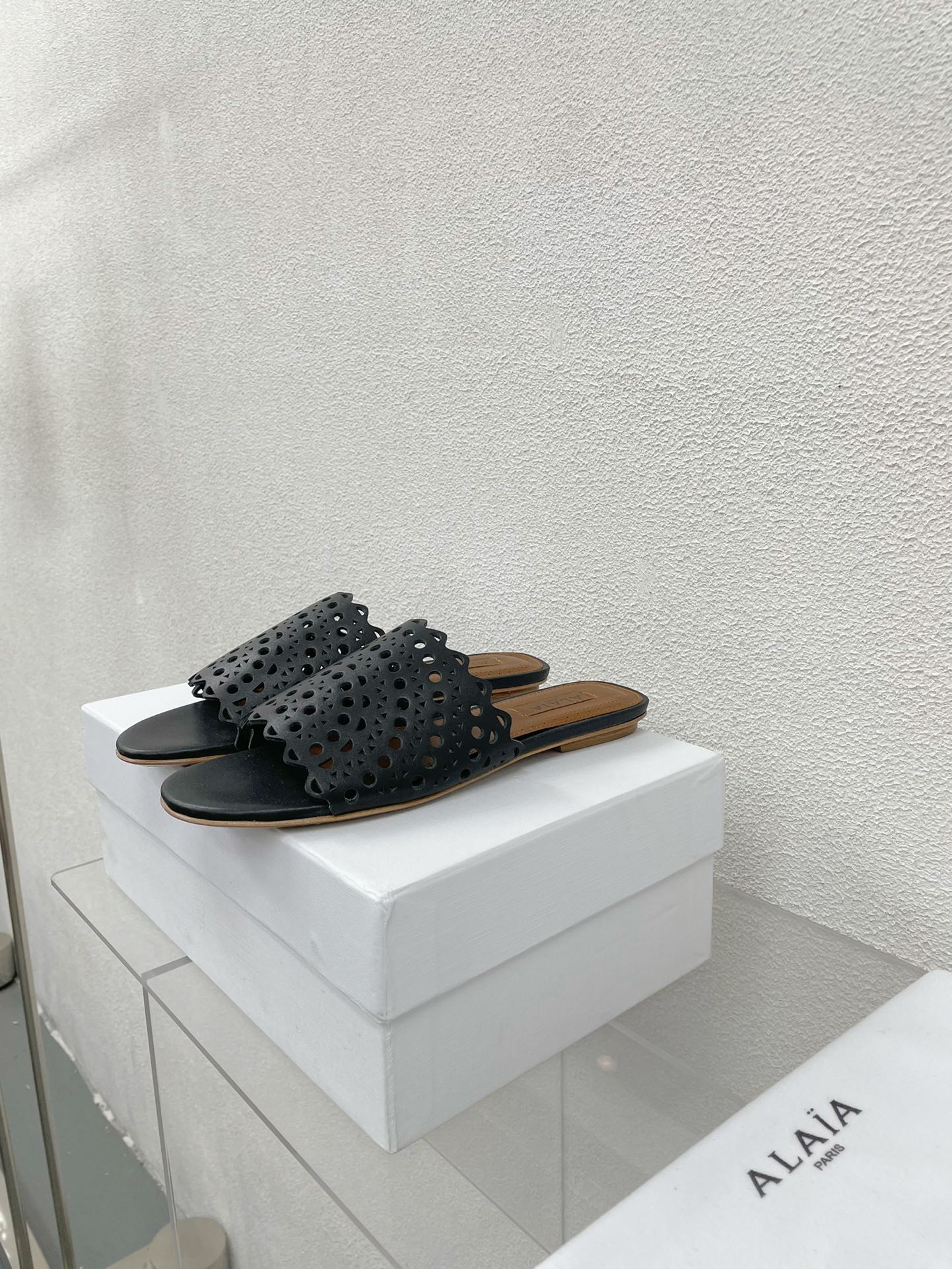 ALAIA VIENNE FLAT MULES IN BLACK LAMBSKIN - 34