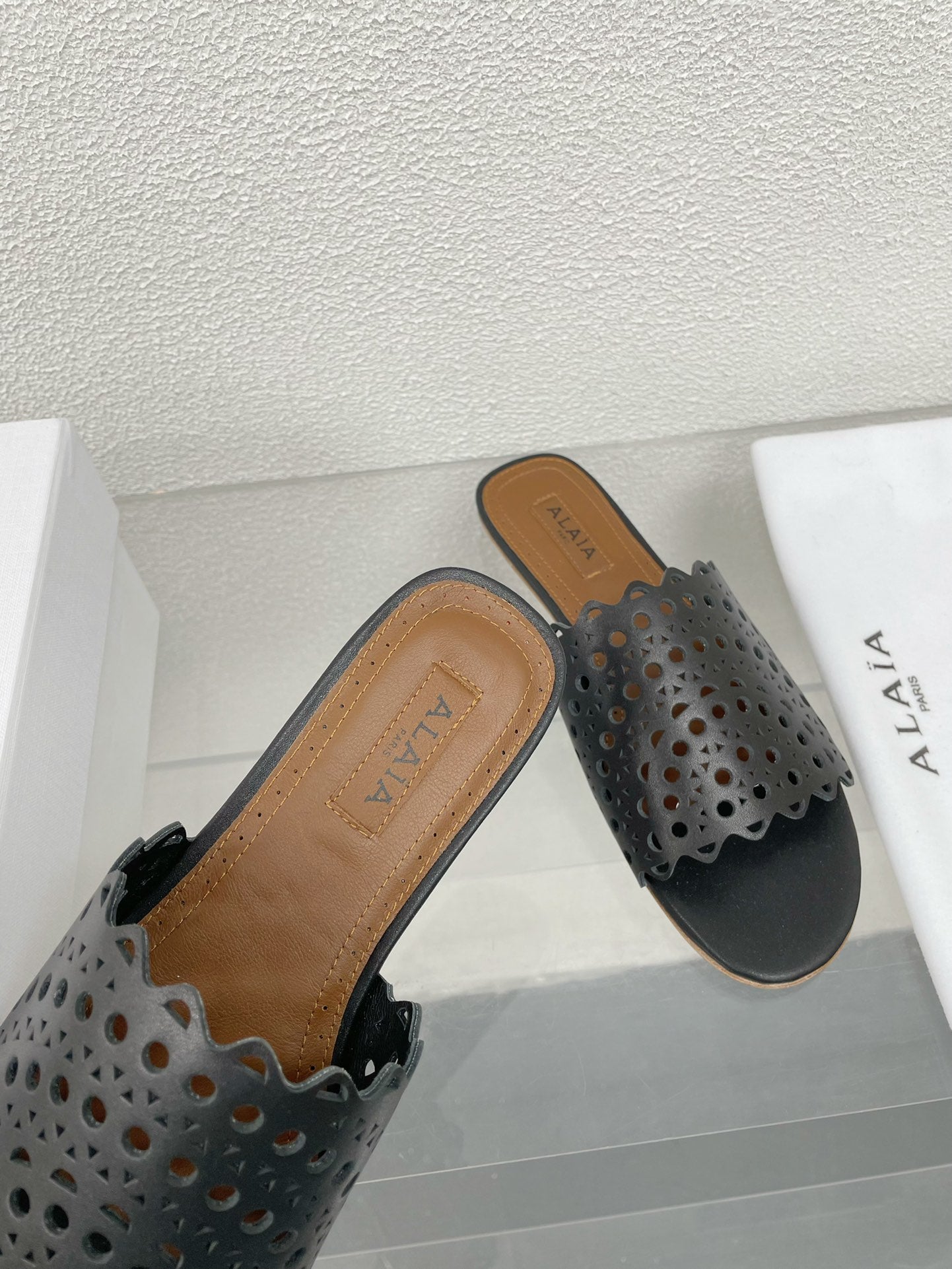 ALAIA VIENNE FLAT MULES IN BLACK LAMBSKIN - 34