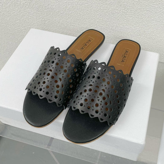 ALAIA VIENNE FLAT MULES IN BLACK LAMBSKIN - 34