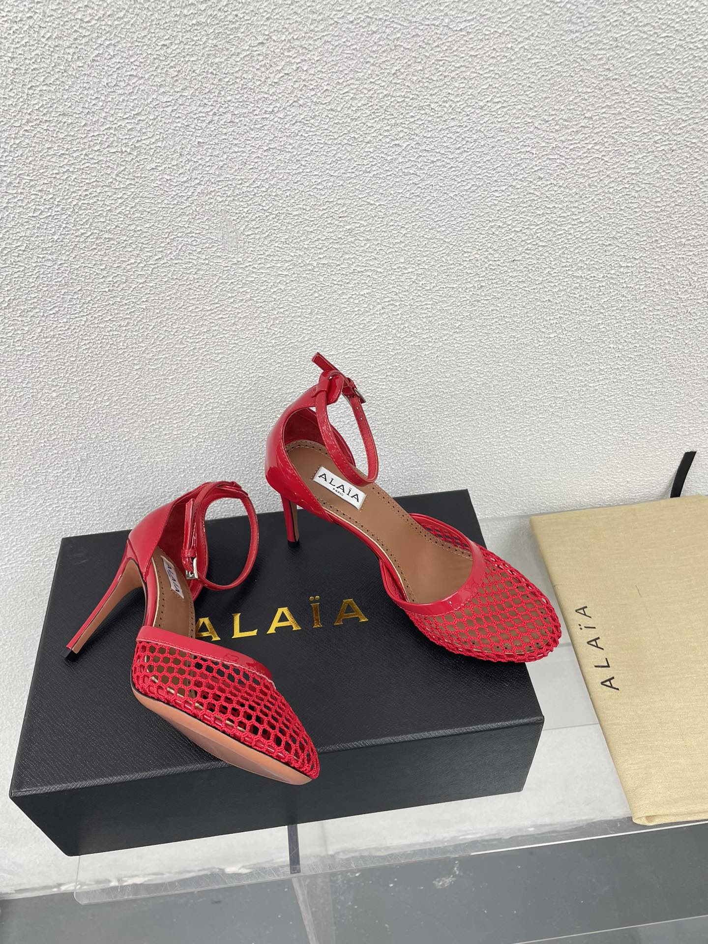 ALAIA HIGH FISHNET 9 CM PUMPS IN CHERRY RED MESH - 34