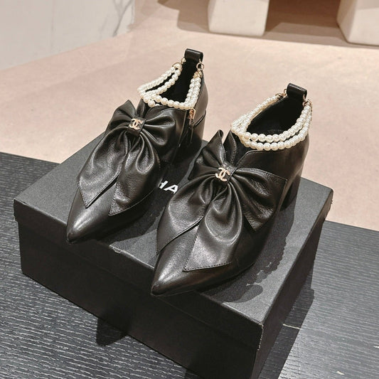 SHORT BOOTS IN BLACK SHEEPSKIN WITH BOW - 35