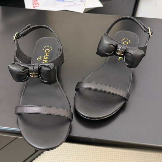 FLAT SANDALS IN BLACK CALFSKIN WITH BOW - 34