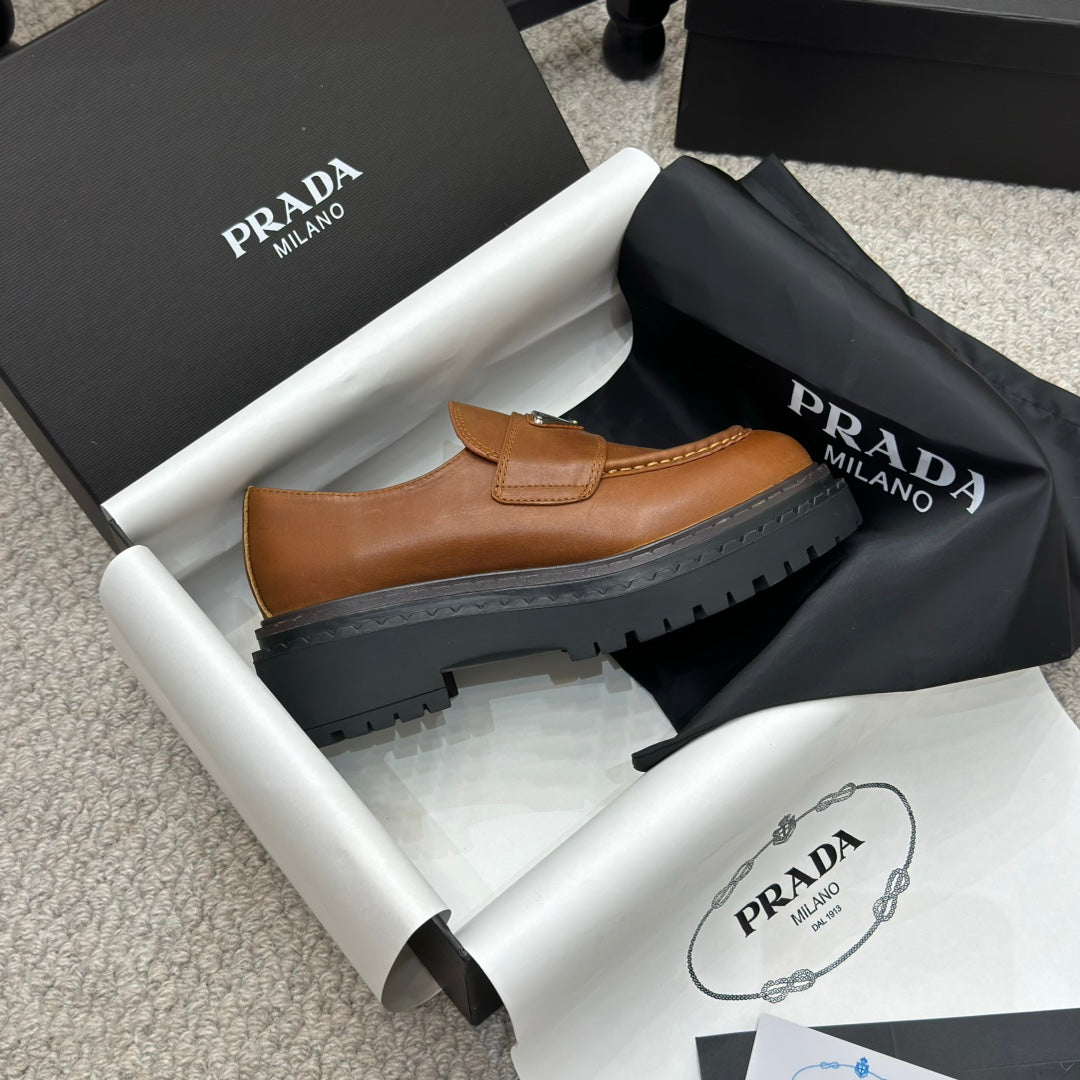 PRADA 25S LOAFER 50MM IN BURNT ORANGE CALFSKIN LOGO - 34