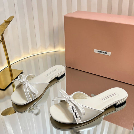 SLIDES SANDALS IN WHITE CALFSKIN BOW IN TRAP - 34