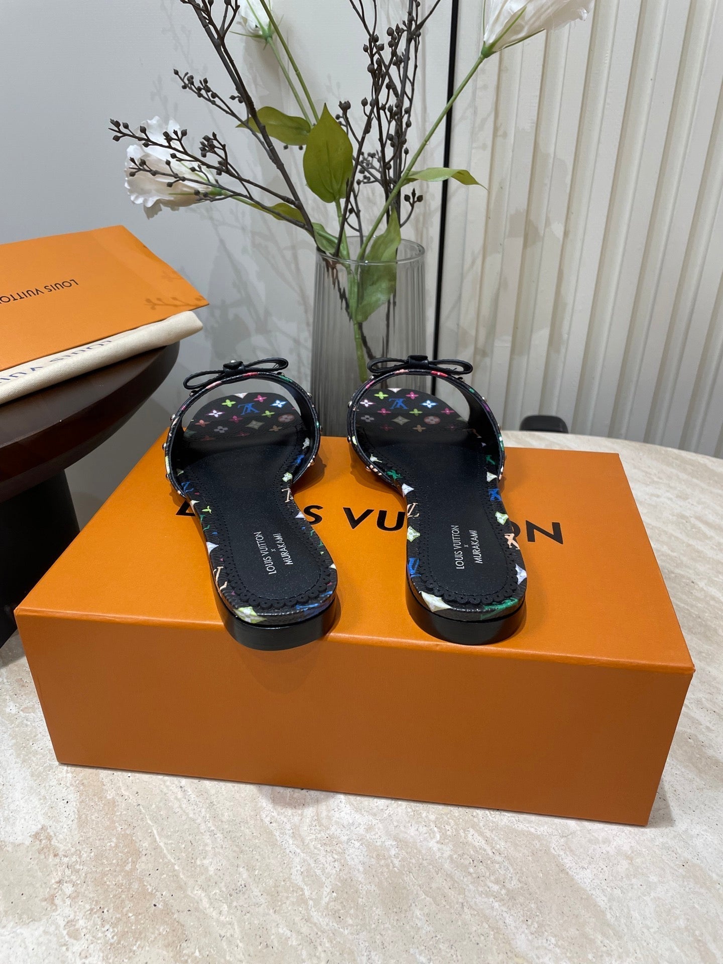 BOW FLAT MULES IN BLACK MONOGRAM LAMBSKIN - 35