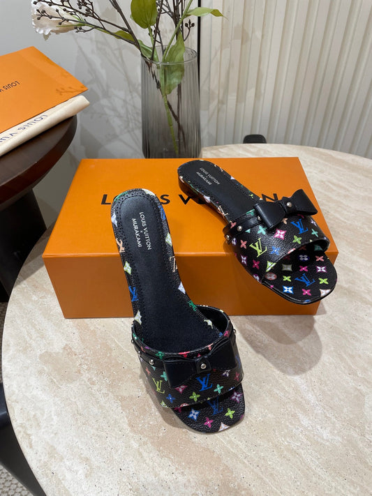 BOW FLAT MULES IN BLACK MONOGRAM LAMBSKIN - 35