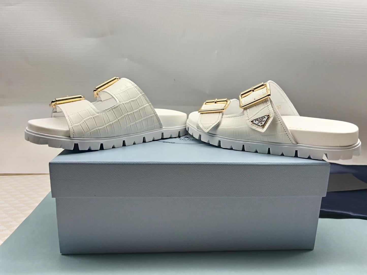 PRADA 26S STRAP SLIDES IN IVORY WHITE CROC EMBOSSED CALFSKIN GOLD HARDWARE