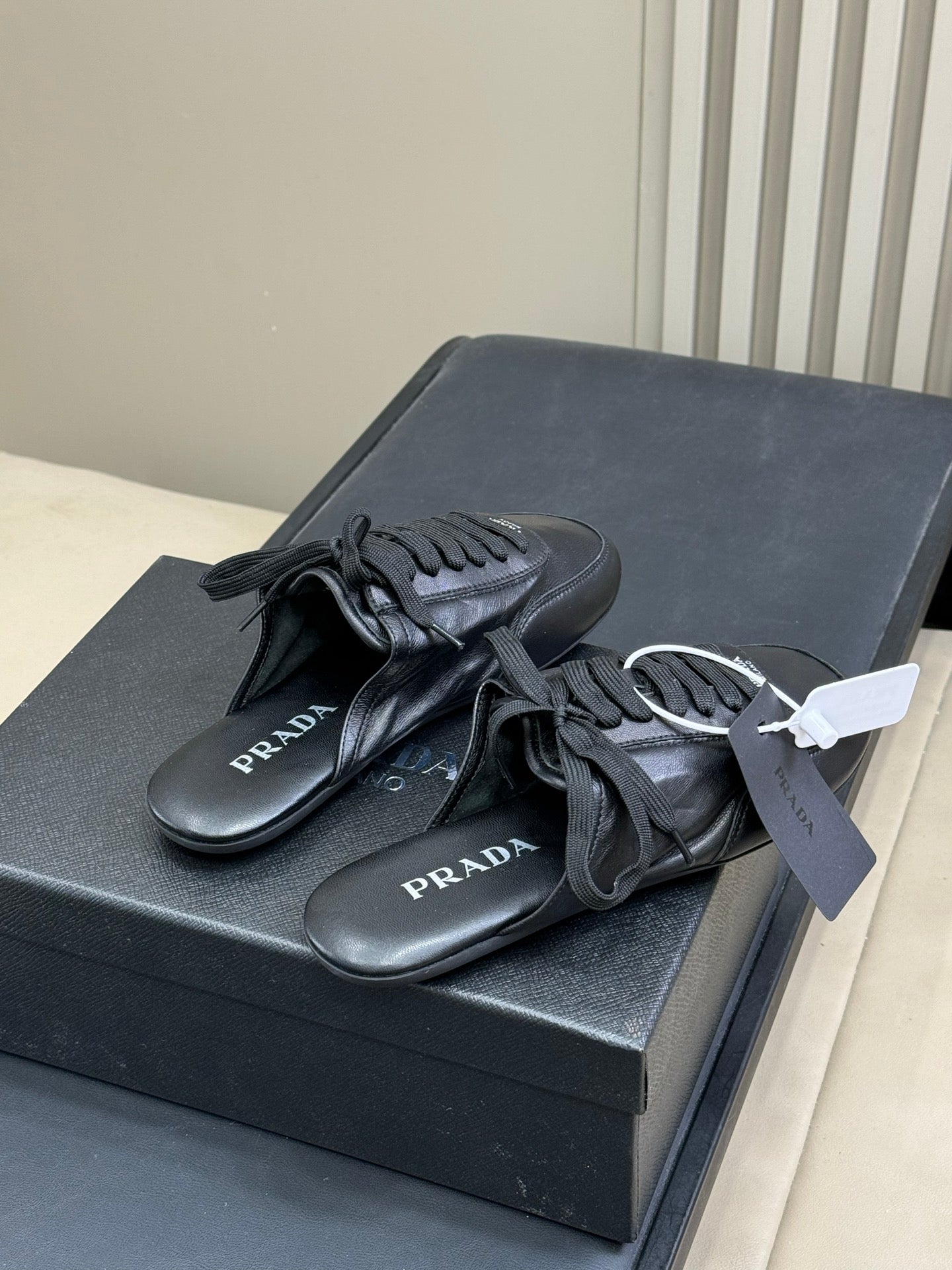 PRADA 25S COLLAPSE MULES IN BLACK CALFSKIN - 35