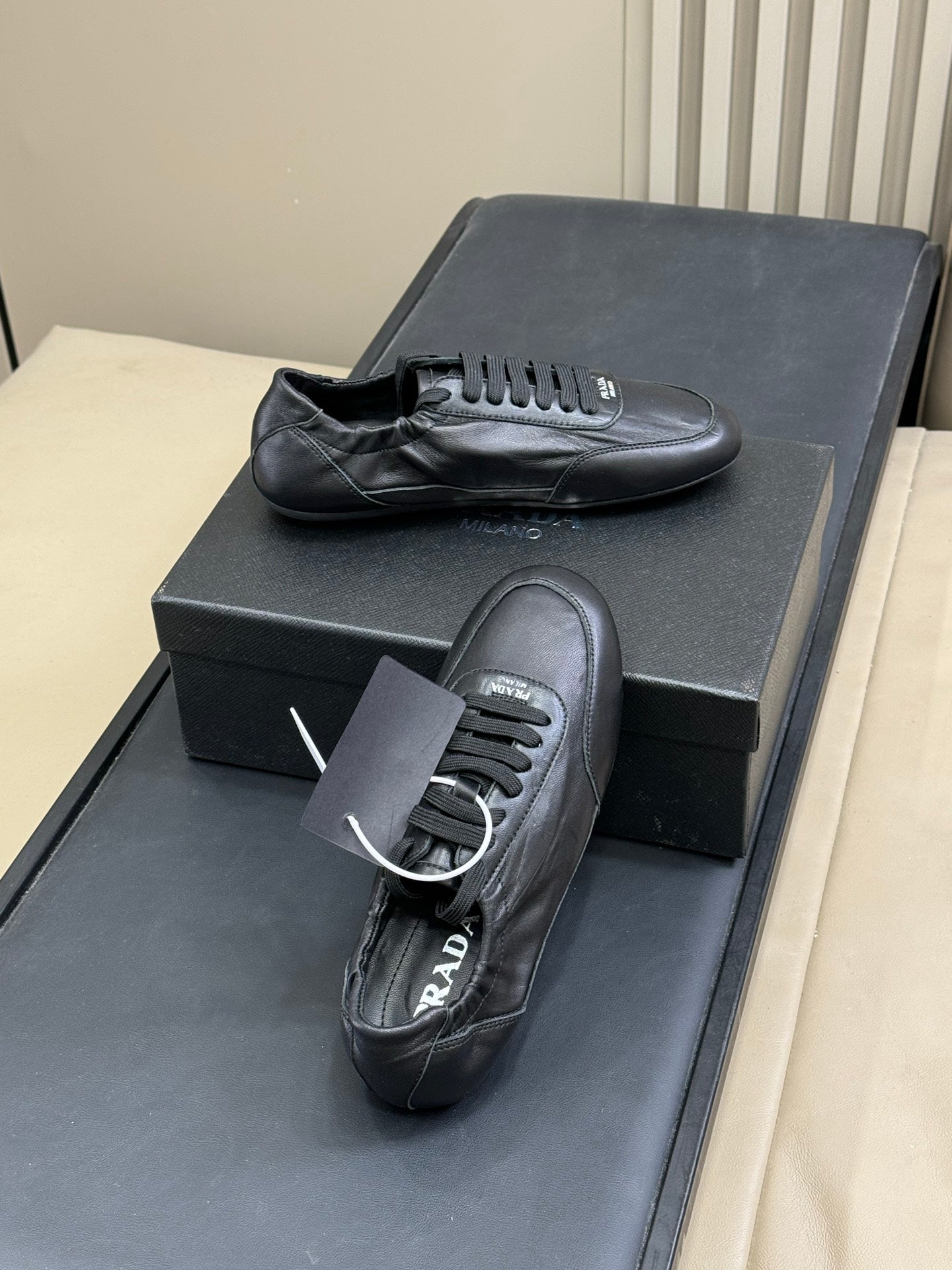 PRADA 25S COLLAPSE FLAT SHOES IN BLACK CALFSKIN - 35