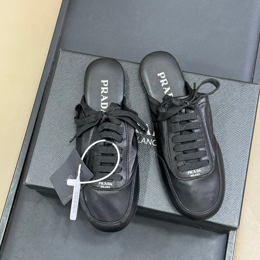 PRADA 25S COLLAPSE MULES IN BLACK CALFSKIN - 35