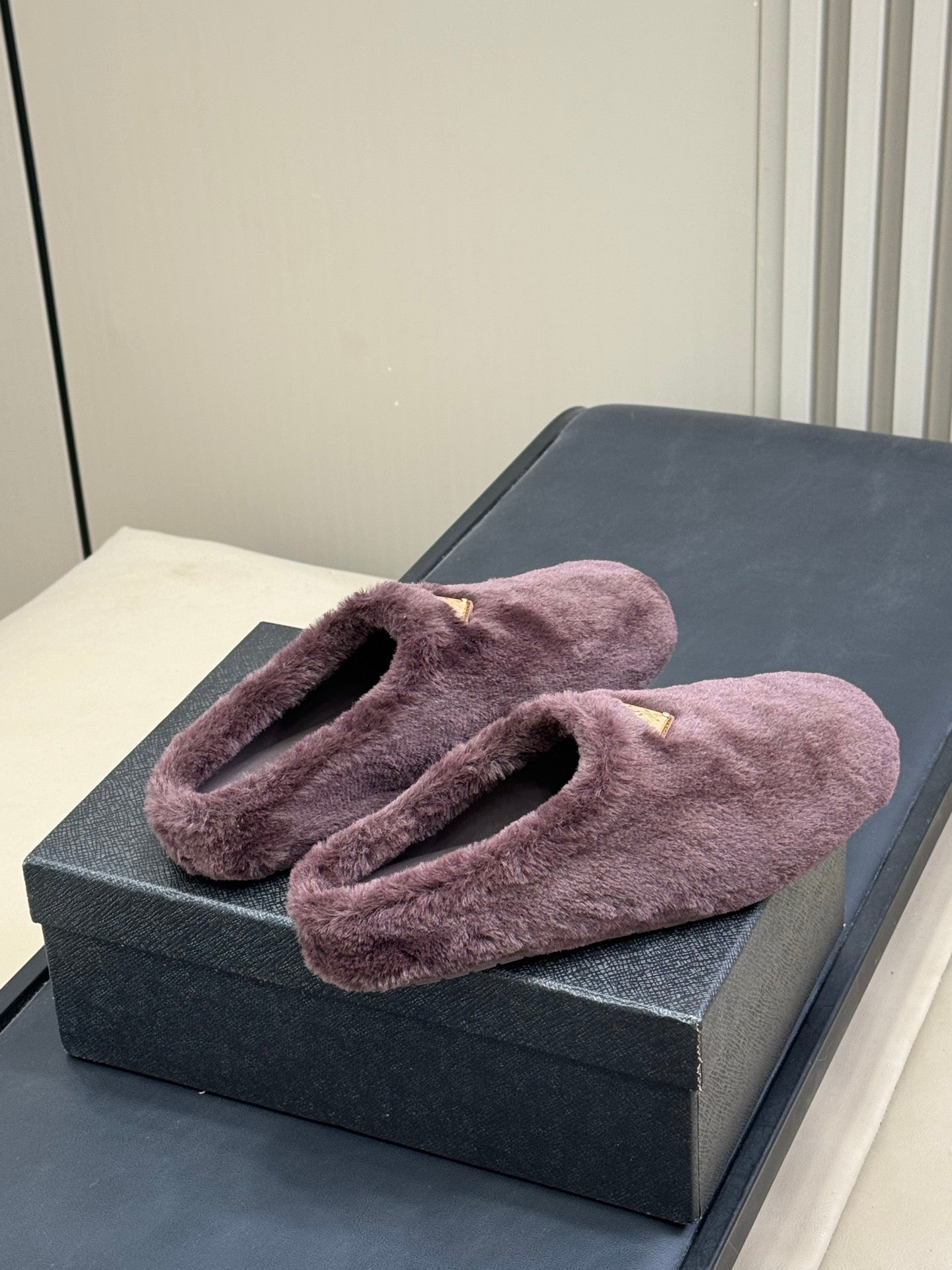 PRADA 25S CLOGS IN WINE RED SHEARLING - 35