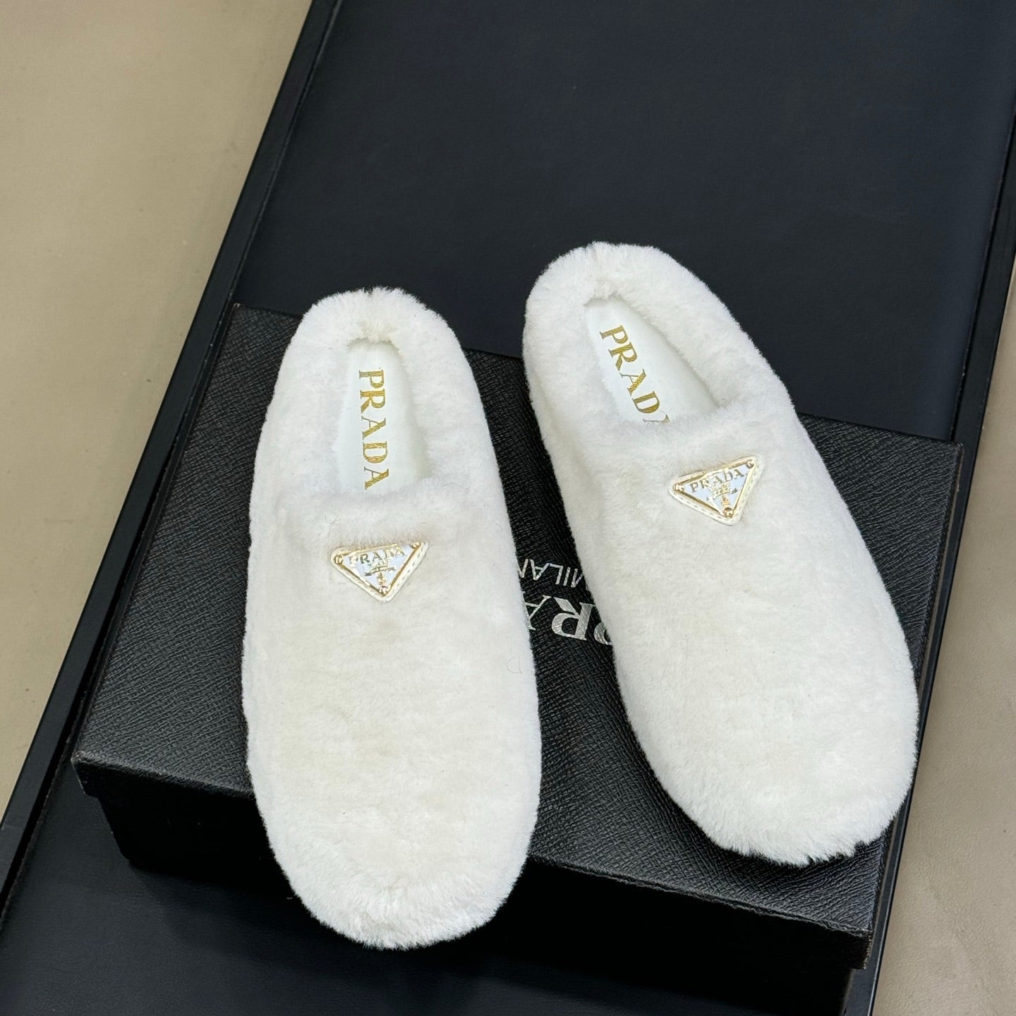 PRADA 25S CLOGS IN WHITE SHEARLING - 35