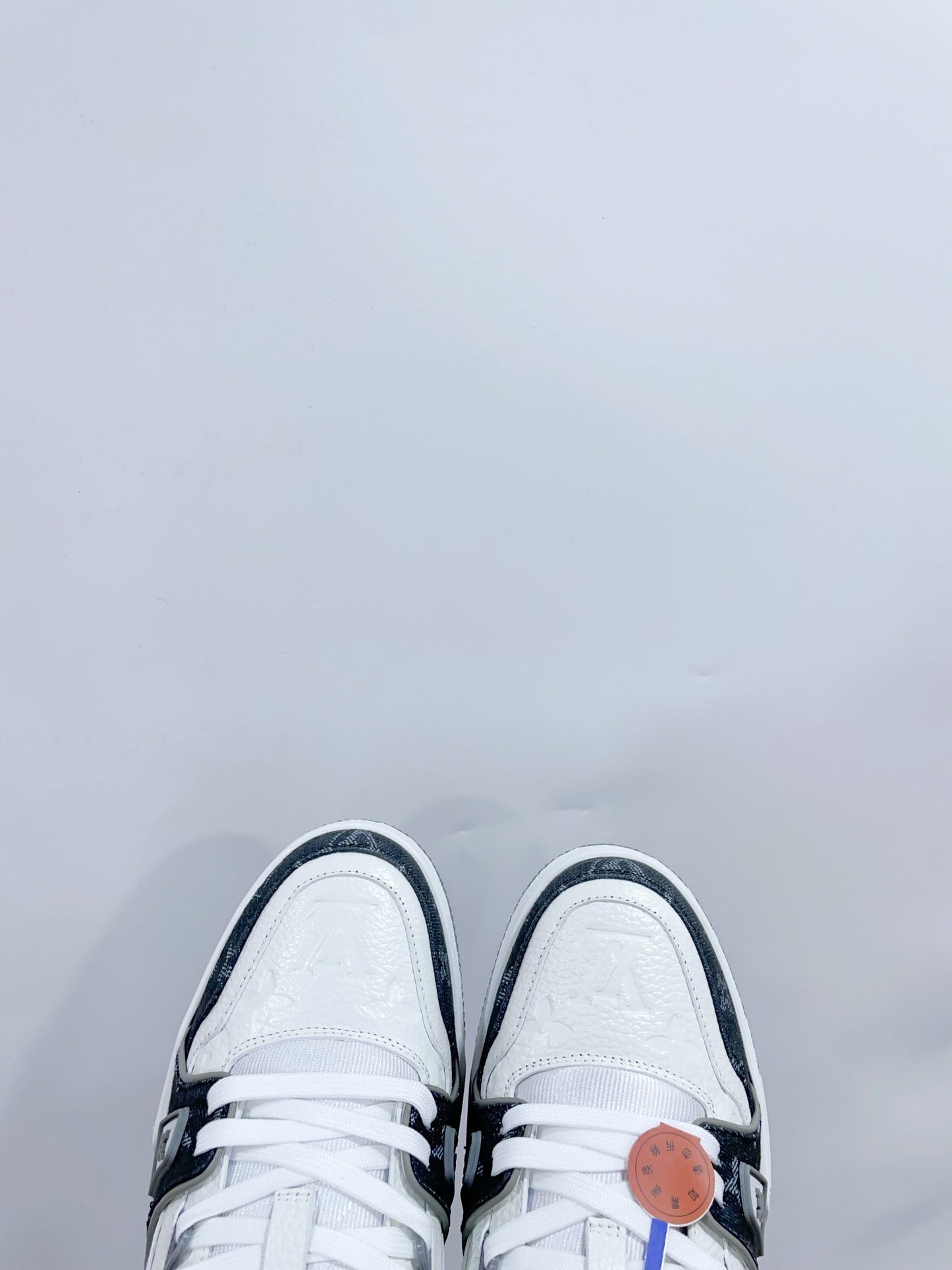 LV TRAINER SNEAKER IN WHITE CALFSKIN AND BLACK MONOGRAM DENIM - 35