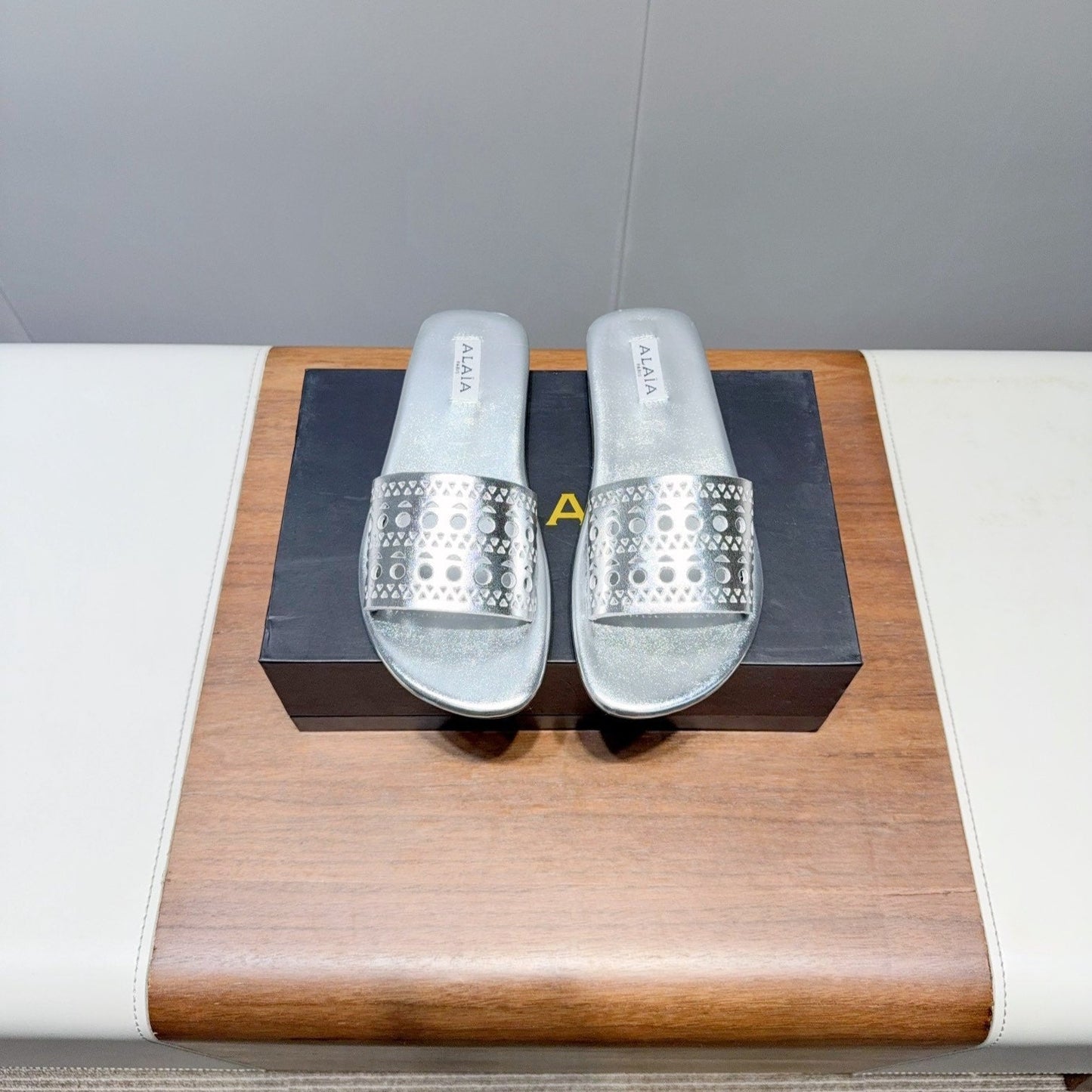 ALAIA FLAT SANDALS WITH PERFORATED STRAPS 25S IN SILVER LAMBSKIN - 35
