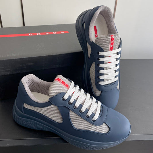 КРОСІВКИ PRADA 26S AMERICA CUP З М'ЯКОЇ ГУМИ ТА ТКАНИНИ ВЕЛОСИПЕДНОГО ТИПУ СИНЬО-СІРОГО КОЛЬОРУ
