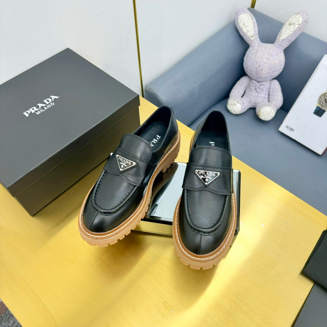 LOAFER WITH TRIANGLE LOGO IN BLACK CALFSKIN - 35