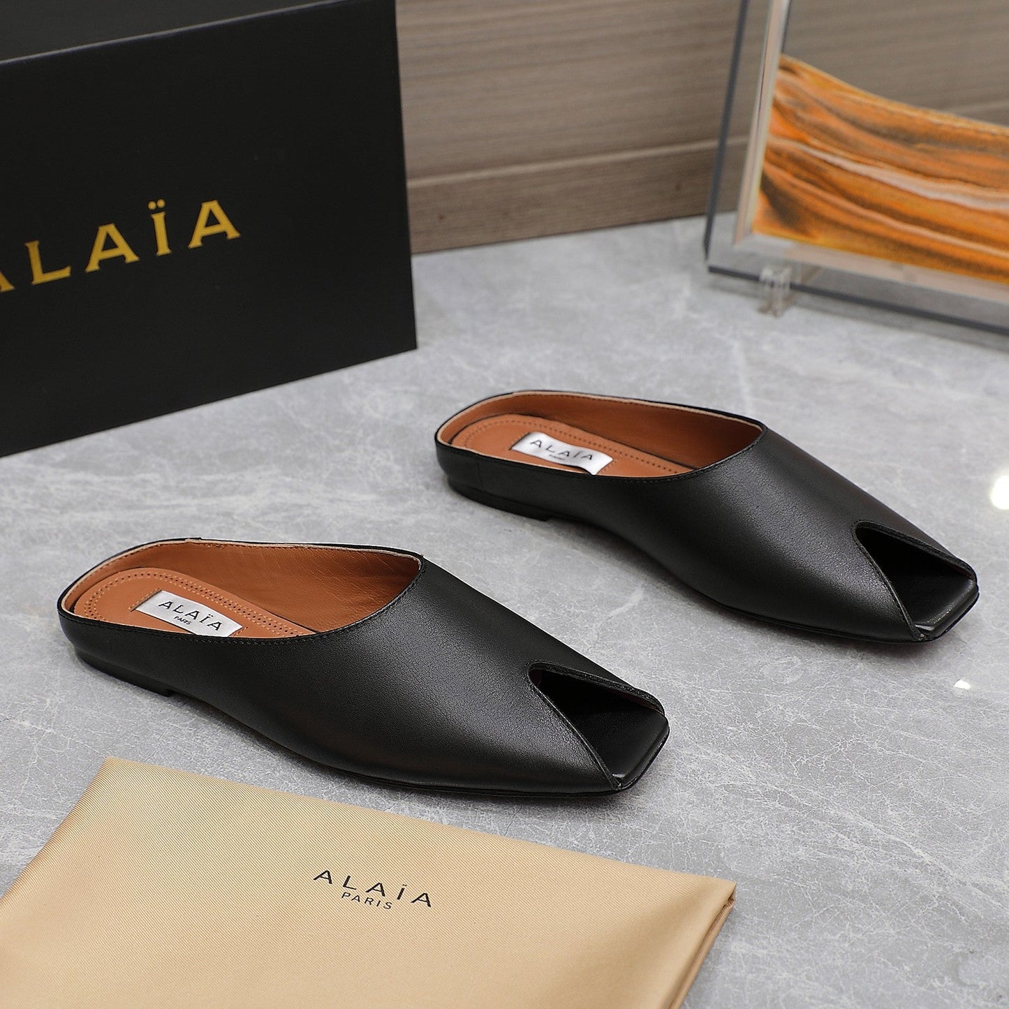 ALAIA FLAT MULE IN BLACK LAMBSKIN - 34