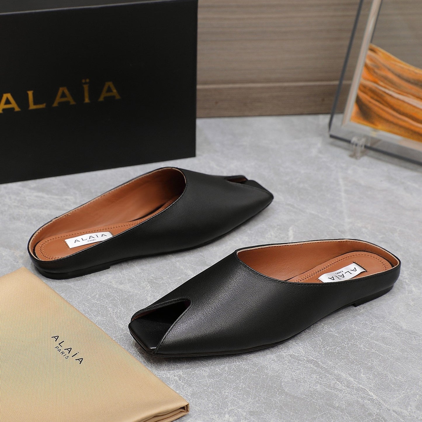 ALAIA FLAT MULE IN BLACK LAMBSKIN - 34