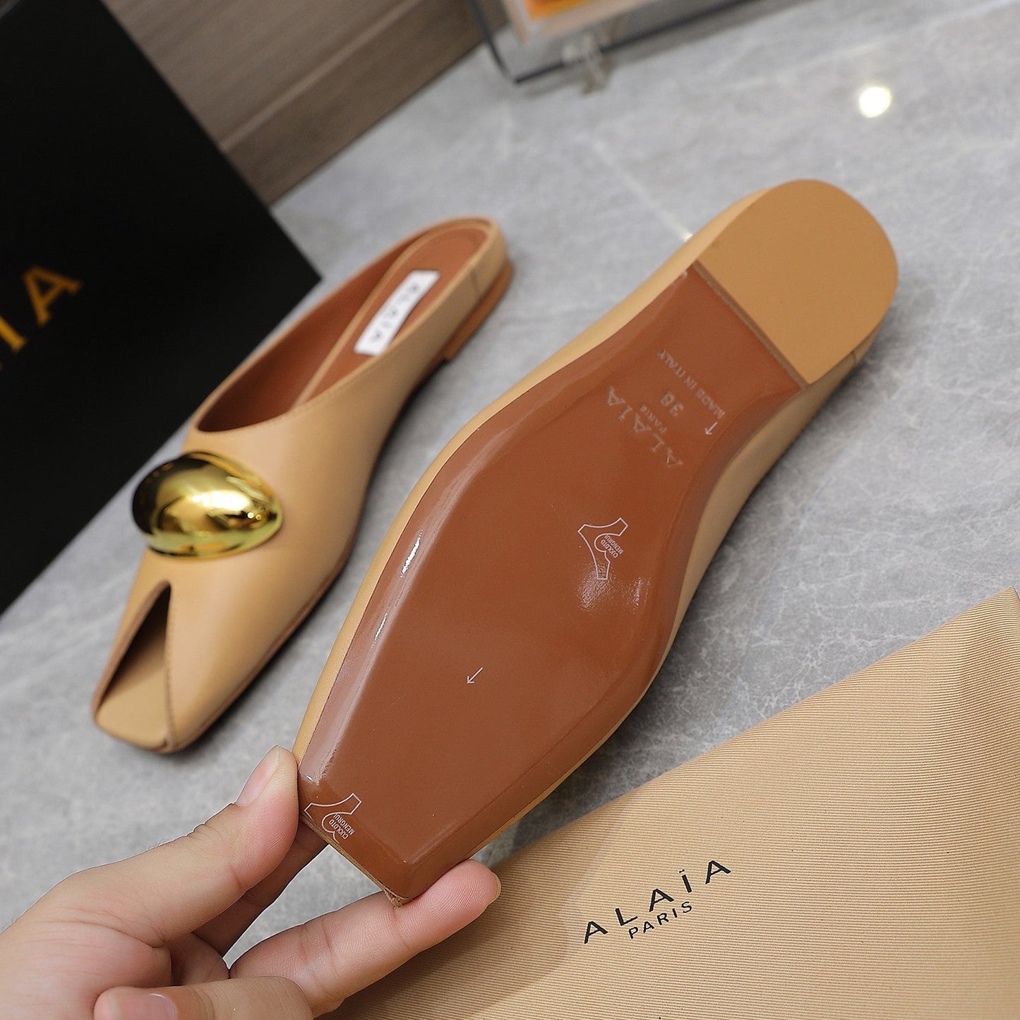 ALAIA FLAT MULE IN SEPIA TAN LAMBSKIN WITH GOLD HARDWARE - 34